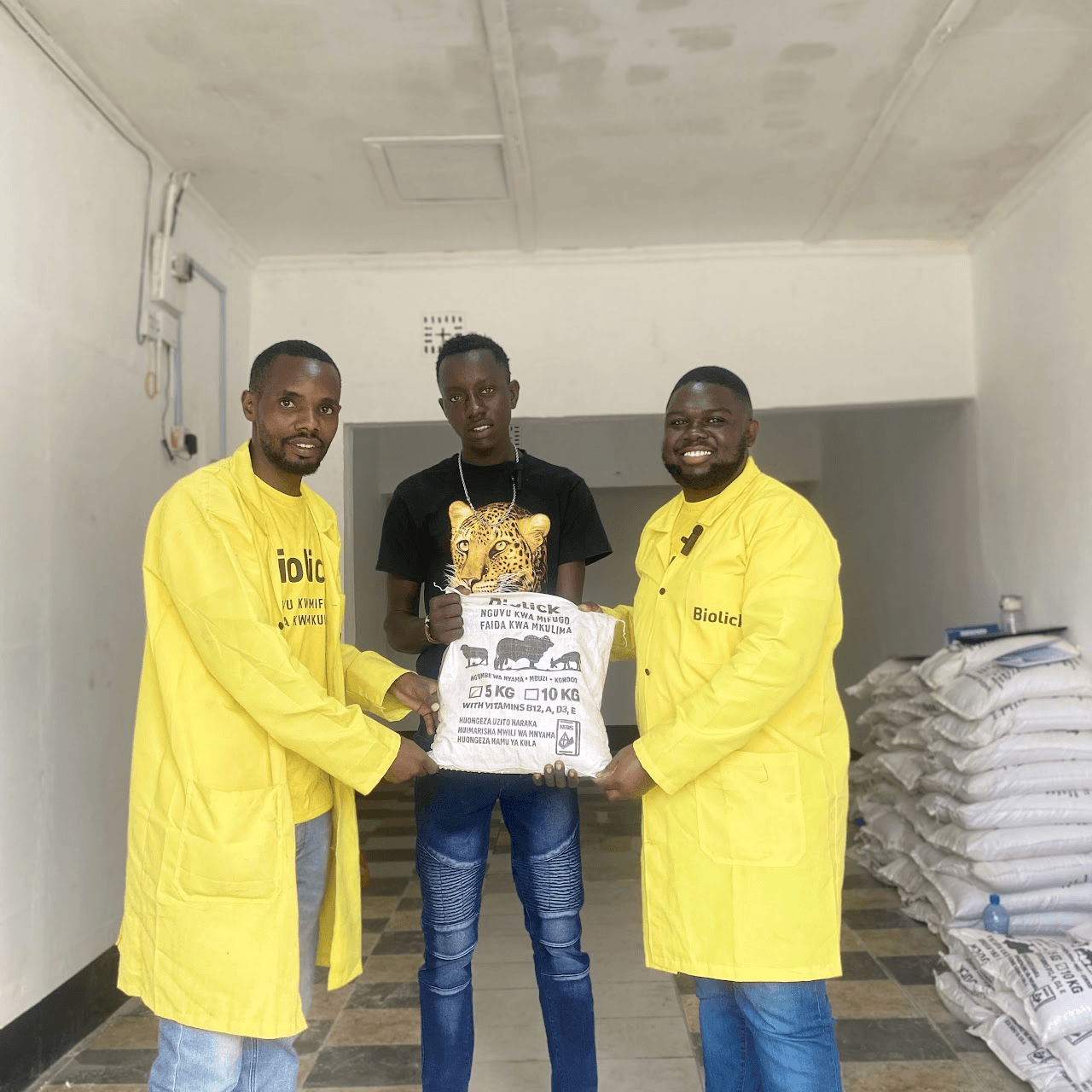 Biolick team members with a satisfied farmer customer